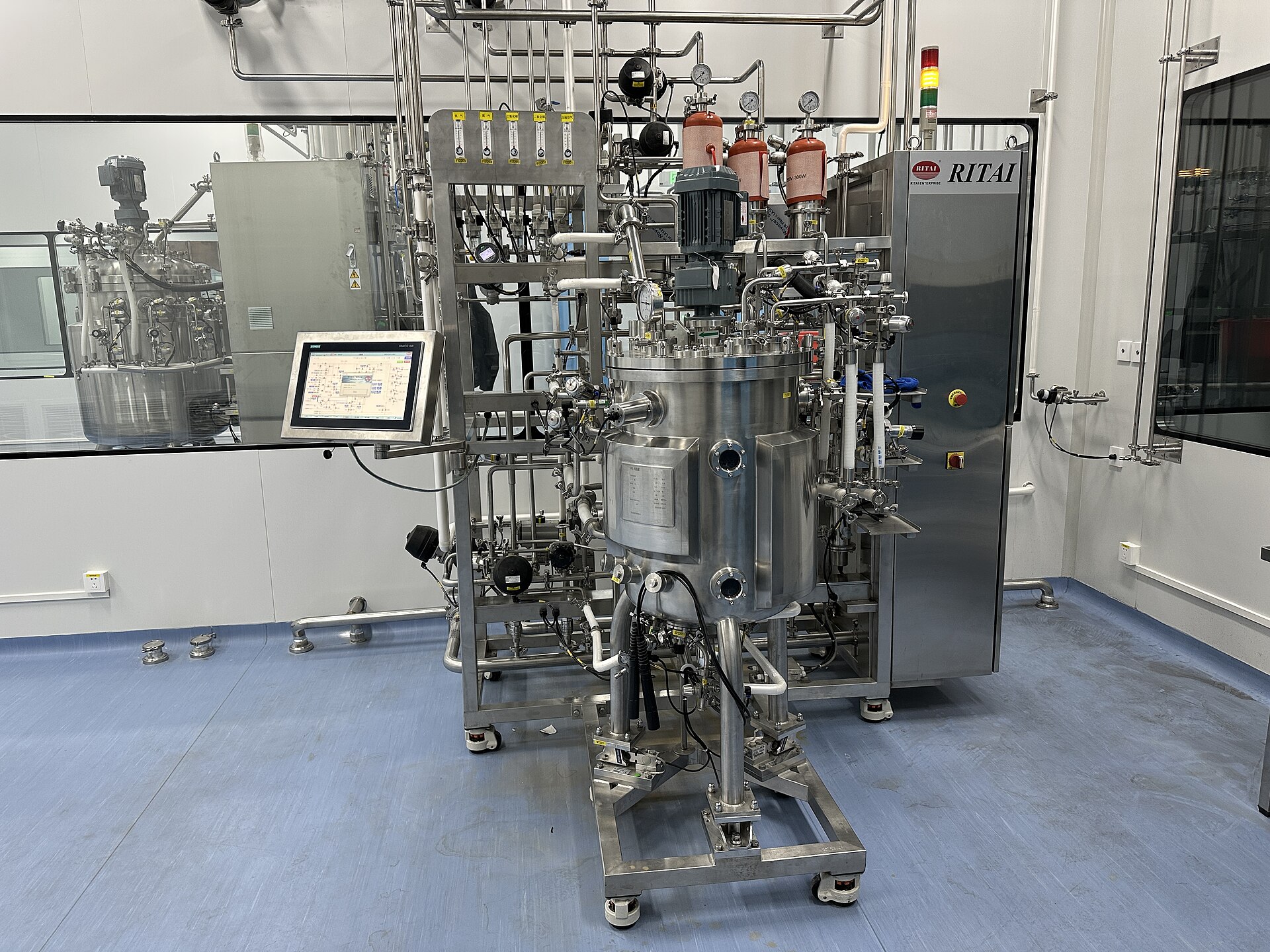 A stainless steel bioreactor skid in operation